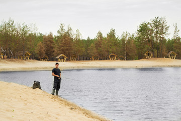 Obraz na płótnie Canvas fishing at the lake on a spinning