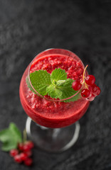 Fresh currant cocktail. Fresh summer cocktail with red currant and ice cubes. Glass of red currant mojito