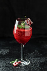 Fresh currant cocktail. Fresh summer cocktail with red currant and ice cubes. Glass of red currant mojito