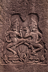 ANGKOR, CAMBOGIA - 15 MARCH 2018:  Historic ruins with ornate stone carvings of Bayon Temple at Angkor complex.