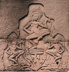 ANGKOR, CAMBOGIA - 15 MARCH 2018: Khmer stone woman at Bayon temple in Angkor Thom, Siem Reap, Cambodia. Dancing apsara on the wall.