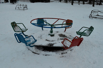 creepy old shabby children's swing from the horror movie, winter dusk