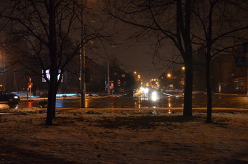 night street in the city, view of the road at night, wet asphalt, cars