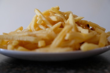 Fries on plate on counter