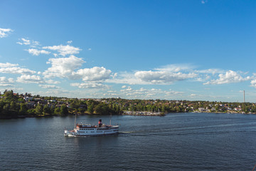 Naklejka premium 10 July 2018 Stockholm, Sweden: Steamship full of tourists. Popular means to get around. Beautiful views of the Swedish islands on a sunny day.