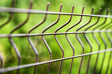 curved welded steel fence closeup