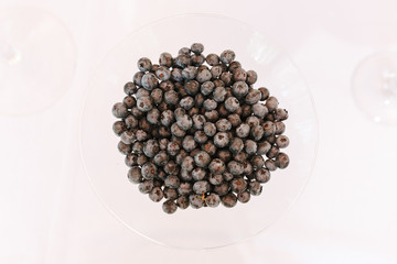 blueberries, Vaccinium corymbosum in glass isolated on white table background