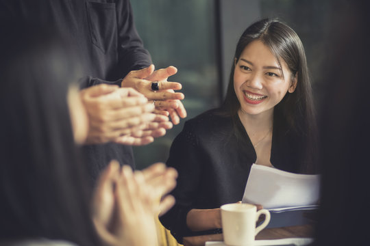 smiling face of asian attractive woman working in office meeting room
