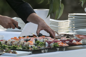 Chief put sushi on table