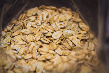 Close-up of oat flakes on black background