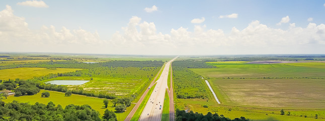 Panorama aerial horizontal view of Interstate 10 highway near rest area with exit and service road....