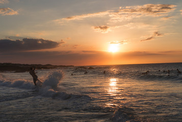 Skim Boarding Into Sunset