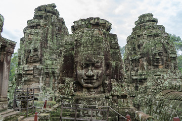 Fototapeta premium Faces of Bayon temple in Phnom Penh - Siem Reap, Cambodia ,before dawn in the morning, reflecting the water.It is the largest castle and religious place in the world.UNESCO is a World Heritage Site.