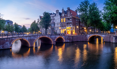 Fototapeta premium Bridge over Keizersgracht - Emperor's canal in Amsterdam, The Netherlands at twilight.