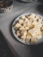 high angle view of pieces of tasty georgian cheese on plate in kitchen
