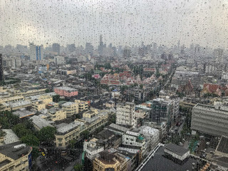 water drop in glass and city background at thailand