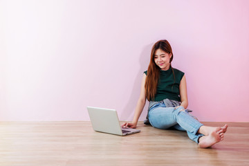 Young Woman Working or Studying on Laptop, Sit on the Floor and Smiling