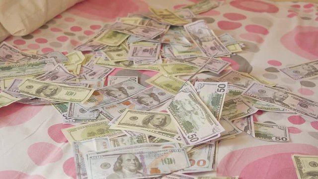 sleeping baby and falling money. Concept unexpected wealth.