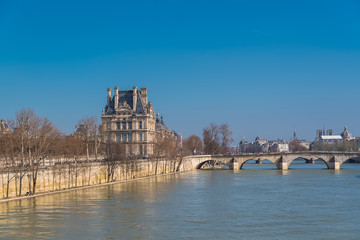 Obraz premium Paris, panorama of the pont Royal, the quai Anatole-France, and Notre-Dame cathedral in background 