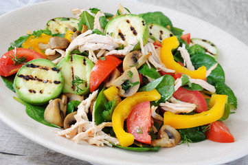 Warm chicken salad with vegetables