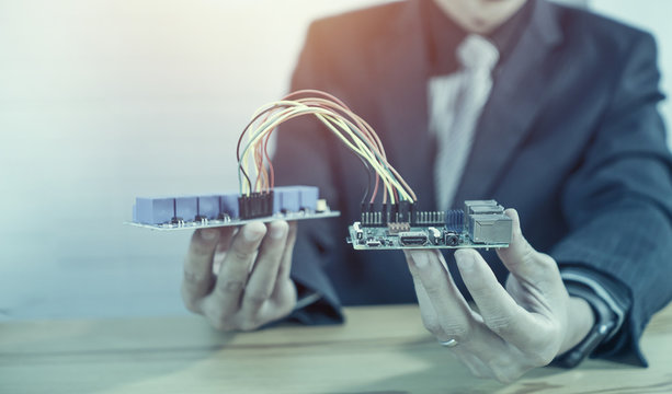 STEM education concept. man coding a meta program it on the computer.electronic board that can be programmed.technology,Mathematics. science. engineering.