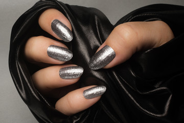 silver glittered nails manicure