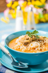 Tomato soup with rice.