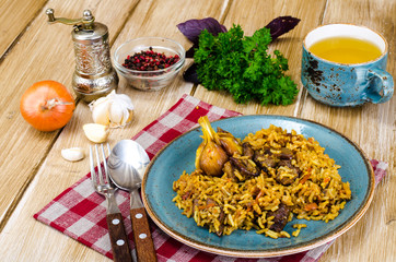 Blue plate with pilaf and meat