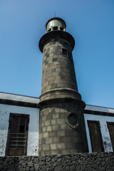 Fototapeta na wymiar old lava stone lighthouse