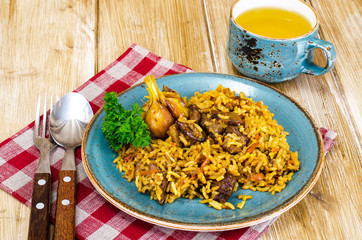 Blue plate with pilaf and meat