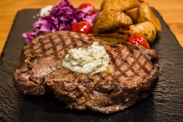 Delicious meat with vegetables, cooked on the grill. Fresh and juicy food