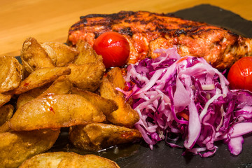 Delicious meat with vegetables, cooked on the grill. Fresh and juicy food