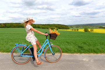 A carefree young woman is ecstatic about her new electric bicycle. She takes herself for a relaxing...