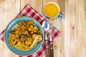 Blue plate with pilaf and meat