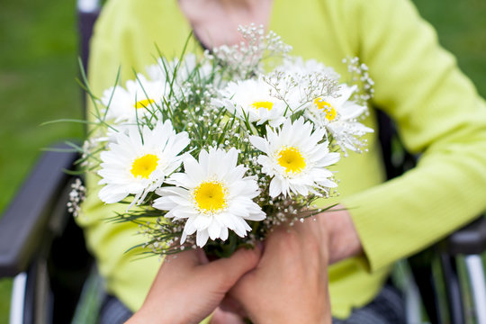 Elderly Woman Receiving Flowers