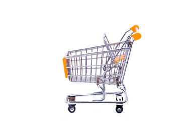 Miniature metal shopping cart with orange elements shot against a white background