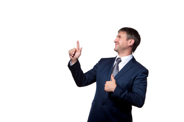 Young handsome businessman with beaming smile pointing with finger