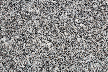 Fine-grained granite rock polished surface seen in detail