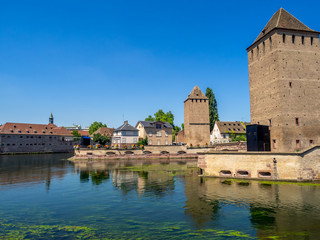 Fototapeta na wymiar The Towers of Ponts Couverts in Strasbourg. Strasbourg is the capital and largest city of the Grand Est region of France and is the official seat of the European Parliament.