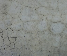 Textured cracks on old concrete wall background 