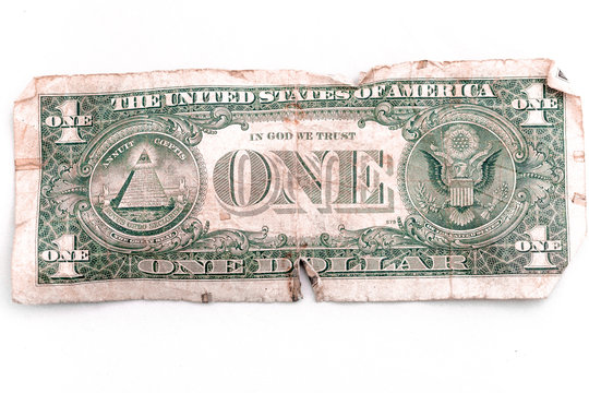 Rear of an old used banknote of one US dollar on a white background