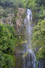 Tall waterfall on the tropical island of Maui, Hawaii.