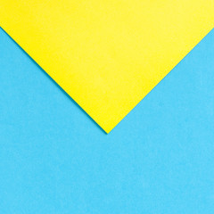 Blue and yellow sheets of paper. Abstract background
