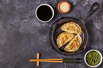 Gyoza or dumplings snack with soy sauce.