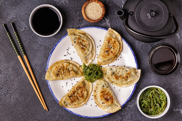 Gyoza or dumplings snack with soy sauce.