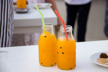Two jars with orange cocktails