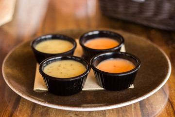 Delicious sauces in four kremankah on a plate to fish and meat