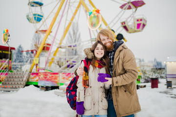 Young couple in love with a happy young man with a beard and a woman on a background of a fucking...