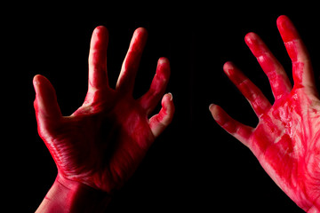 Bloody theme lone murderer: the murderer shows bloody hands and experiencing depression and pain © lijphoto