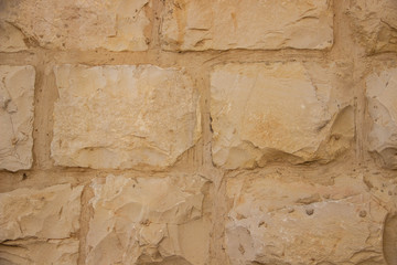 Stone wall background with round stones